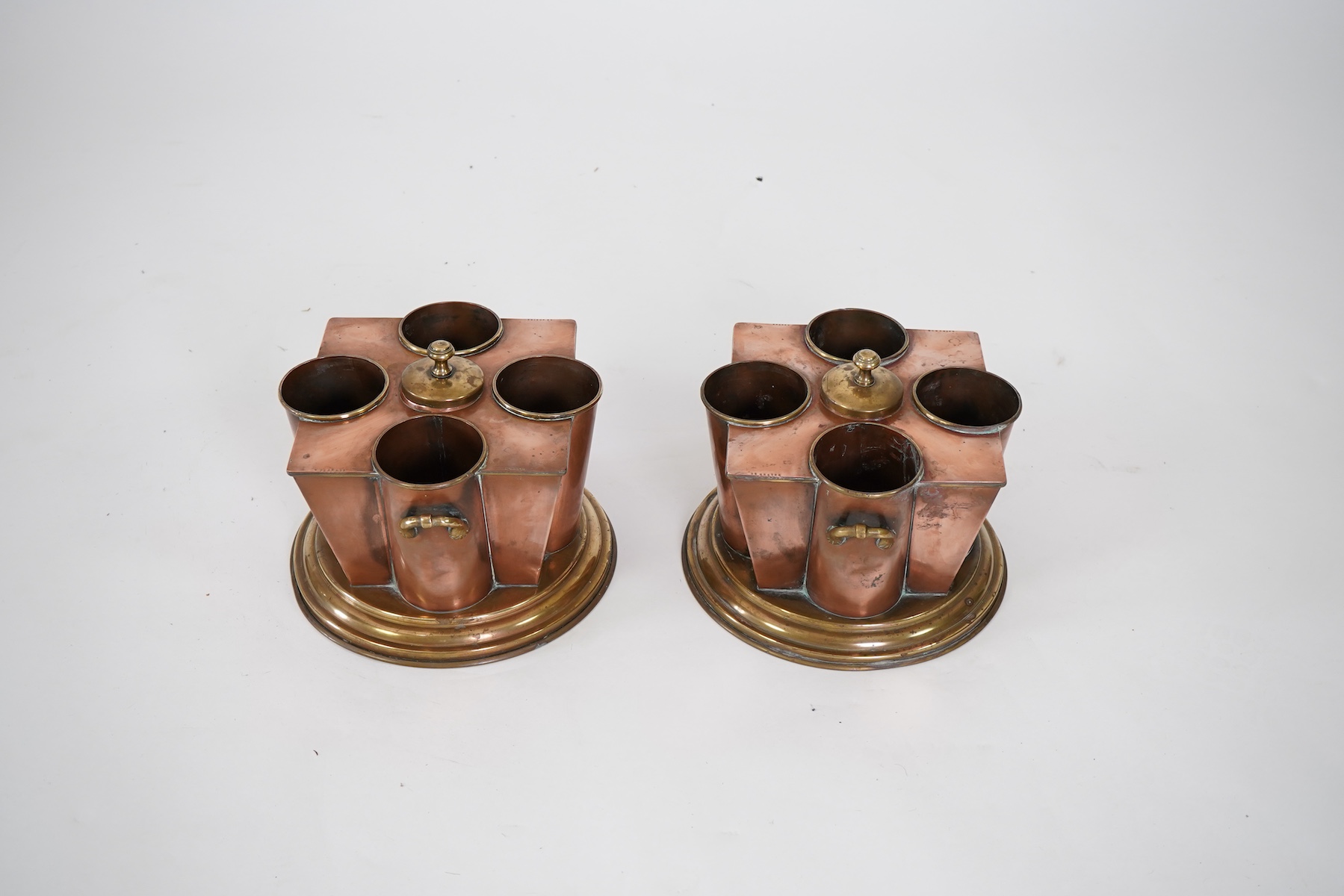 A pair of Art Deco copper and brass champagne/wine coolers, from the passenger ship SS Boston (1924-1942)